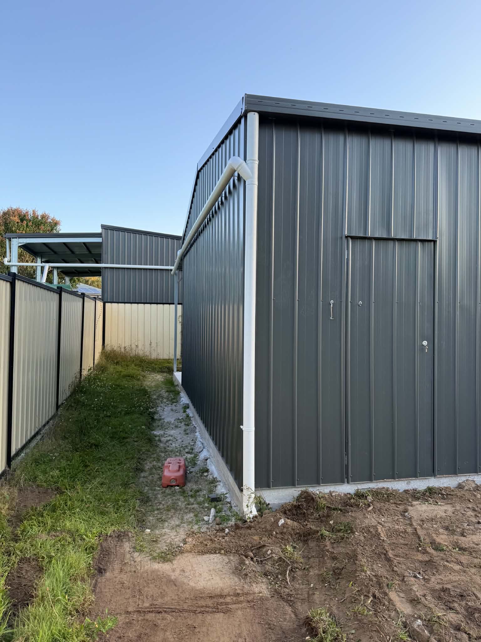 Colorbond shed exterior with new guttering and downpipe
