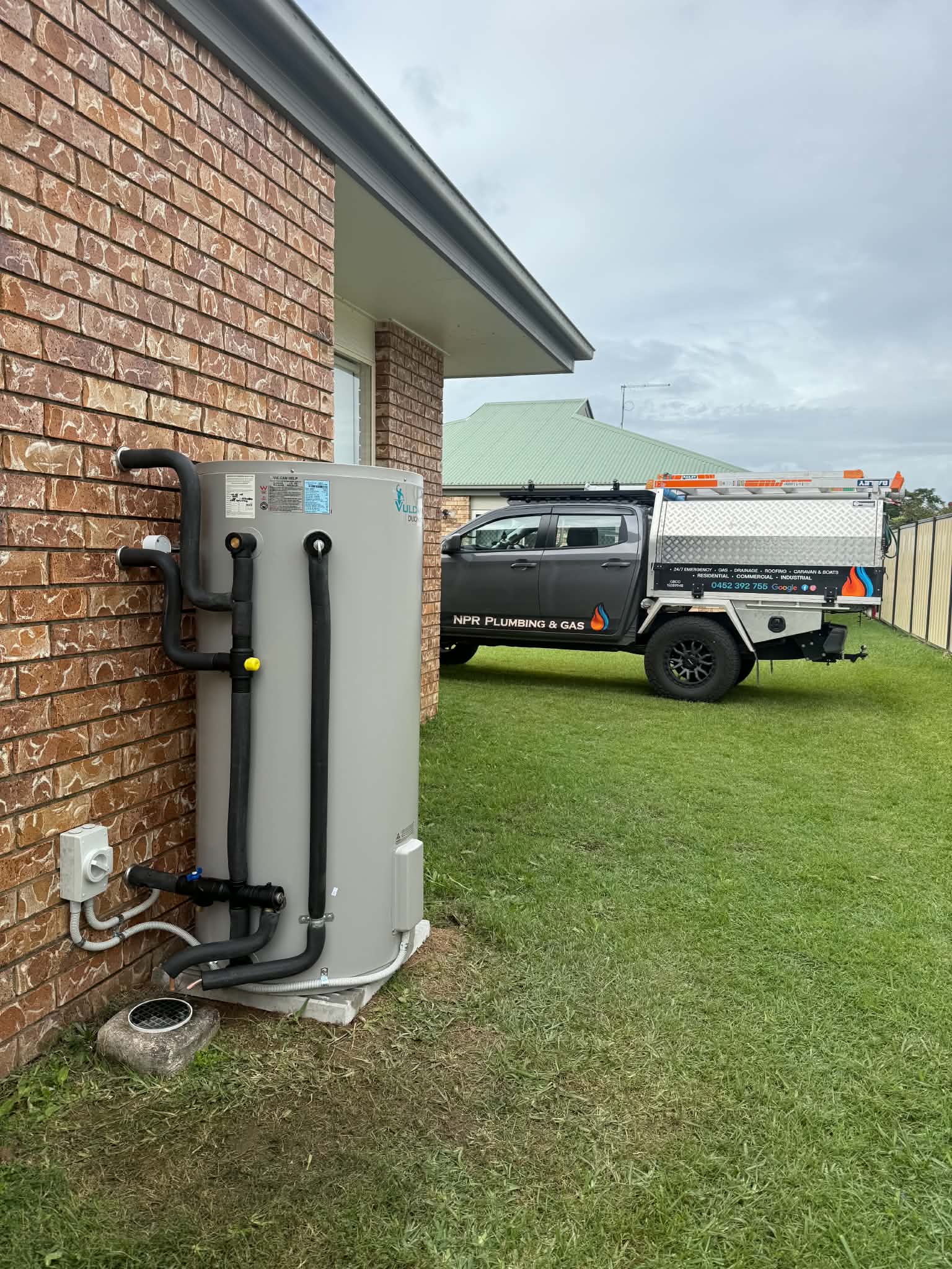 Vulcan hot water system installation at a brick home